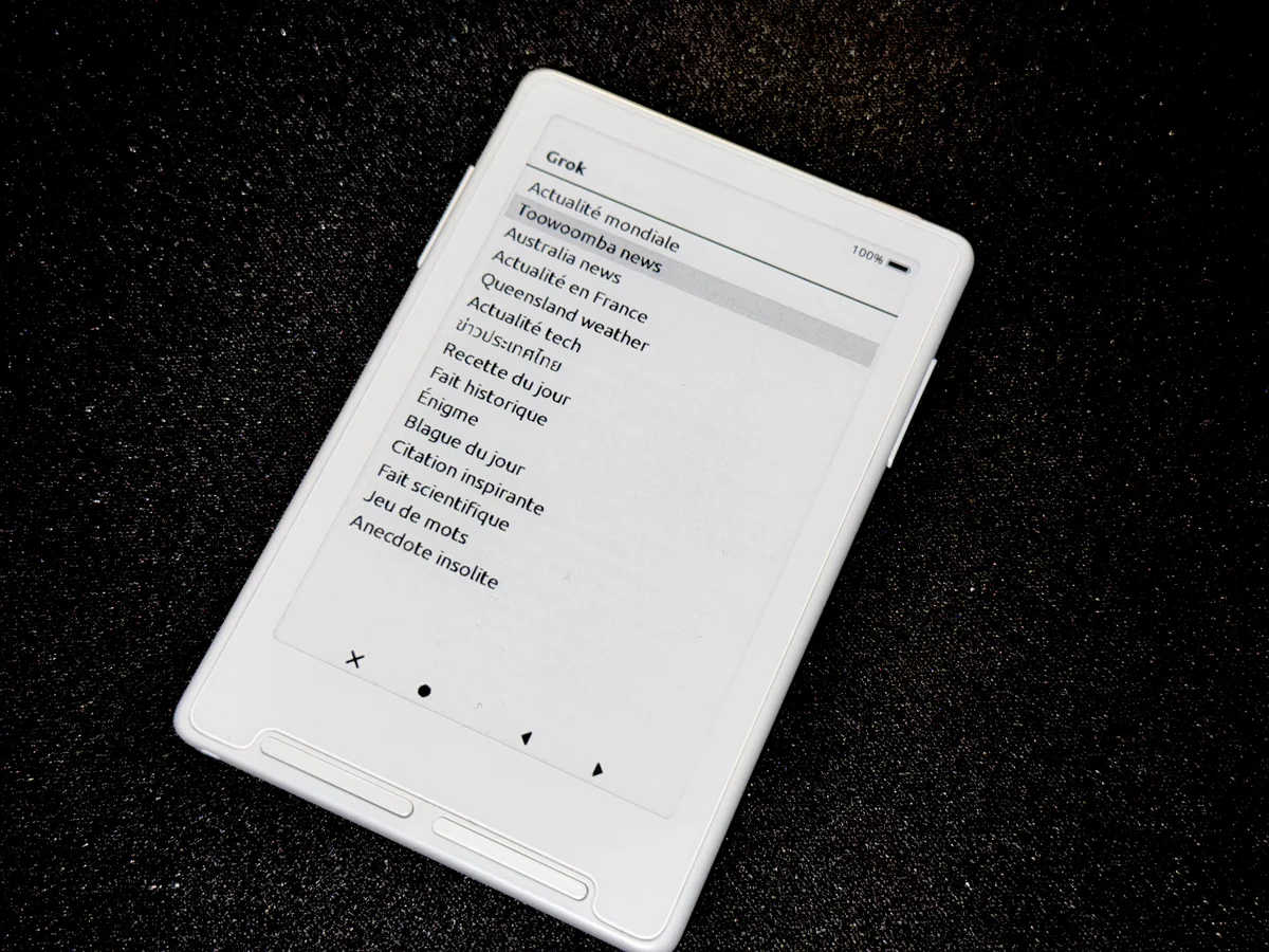 Xteink X4 e-ink reader running Grok — topic menu on the 800×480 monochrome display