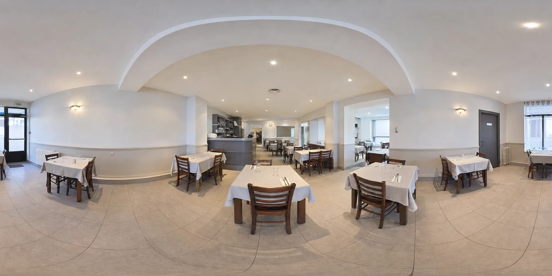 Before, a plain restaurant dining room with white tablecloths and bare walls